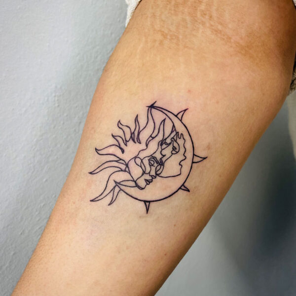 atticus tattoo, black and grey line tattoo of the sun and moon kissing