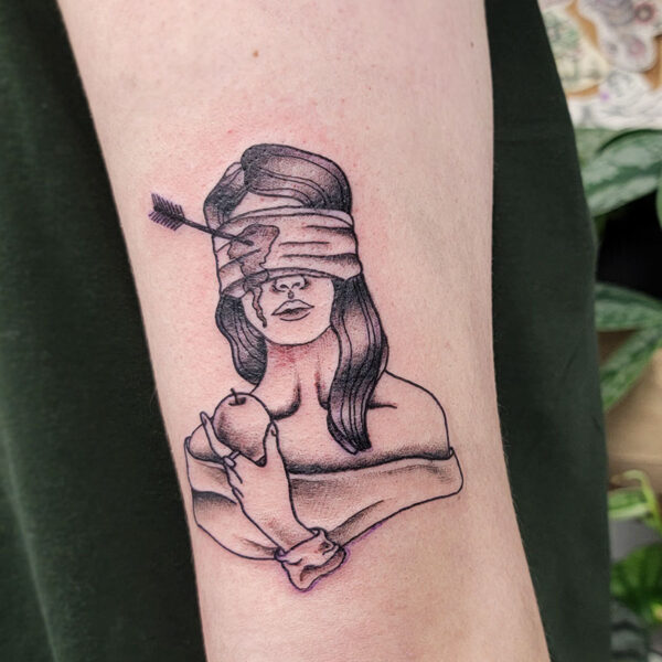 atticus tattoo, black and grey tattoo of a woman wearing a blindfold with an arrow in her eye and holding an apple