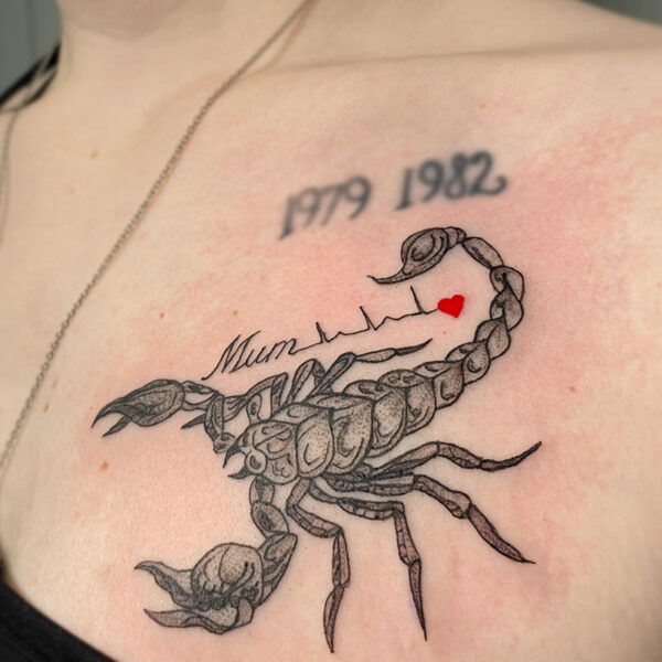 atticus tattoo, black and grey tattoo of a scorpion with the word mum and a red heart