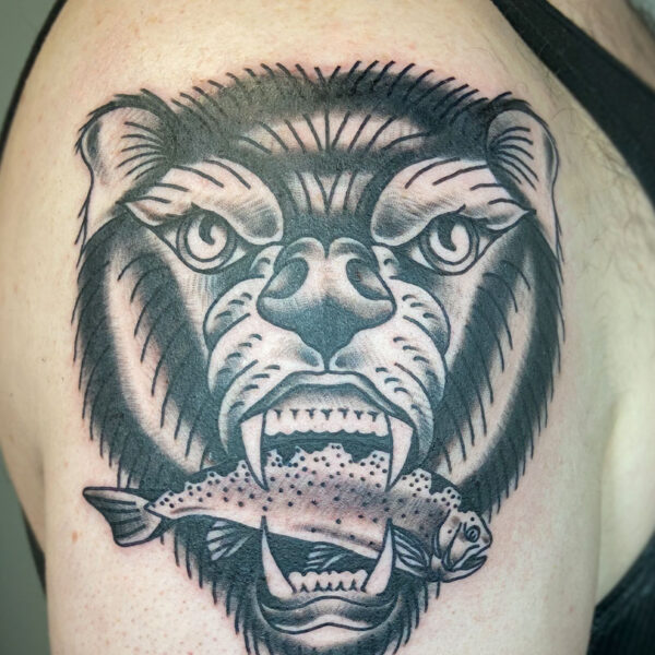 atticus tattoo, black and grey, American traditional tattoo of a bear biting a fish