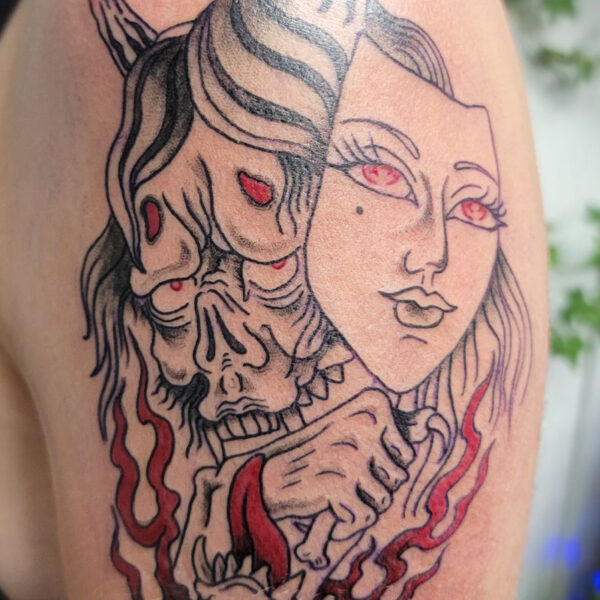 atticus tattoo, japanese traditional tattoo of a demon holding a mask of a woman's face