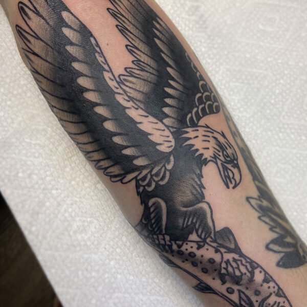 atticus tattoo, black and grey, American traditional tattoo of an eagle catching a fish
