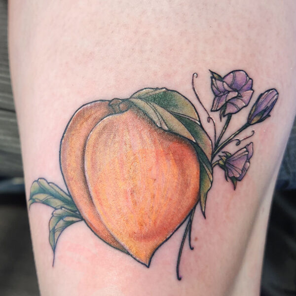 atticus tattoo, neotraditional tattoo of a peach and purple flowers