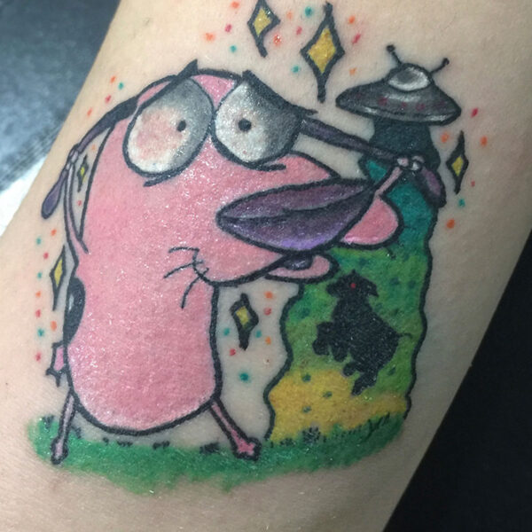 atticus tattoo, coloured tattoo of Courage the Cowardly Dog with a UFO abducting a sheep behind him