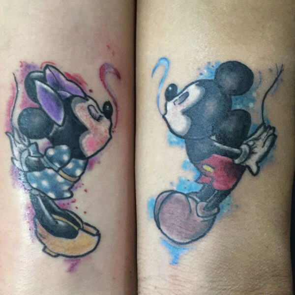 atticus tattoo, coloured tattoo of Mickey and Minnie kissing