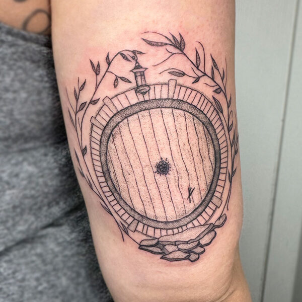 atticus tattoo, black and grey tattoo of Bilbo's door from Lord of the Rings