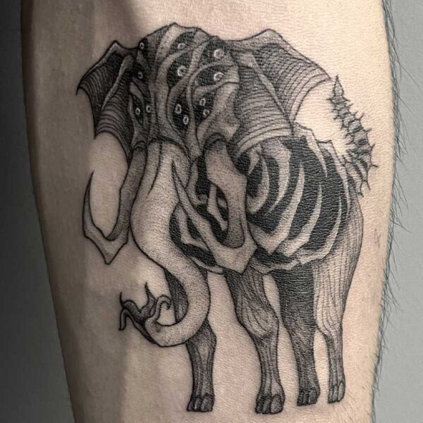 atticus tattoo, black and grey tattoo of an elephant monster