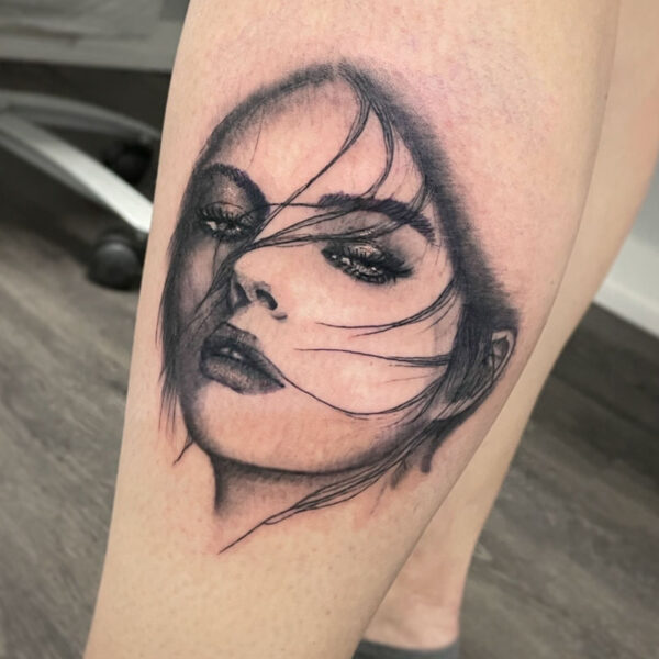atticus tattoo, black and grey realism of a portrait of a woman