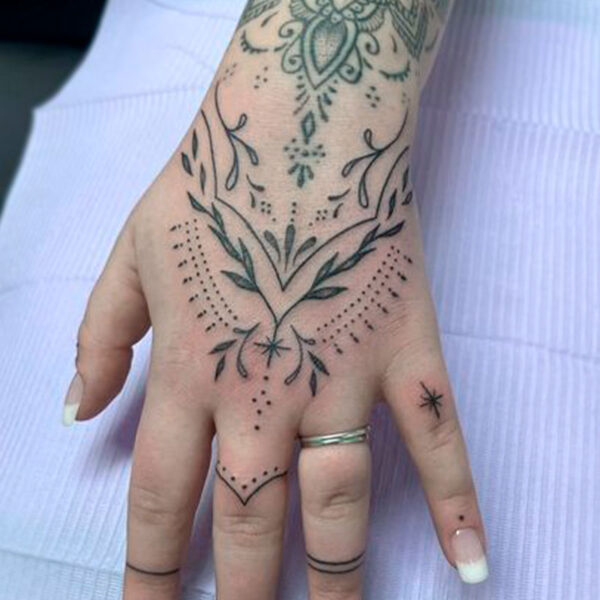 atticus tattoo, hand tattoo in a simple henna design