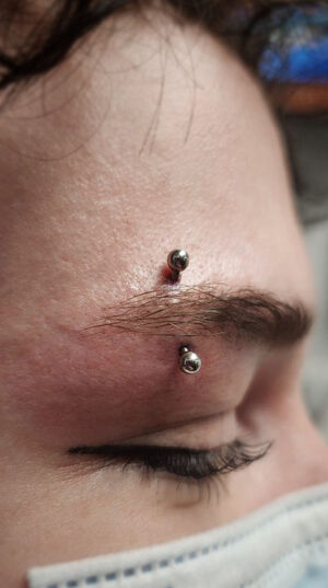 atticus tattoo, eyebrow piercing