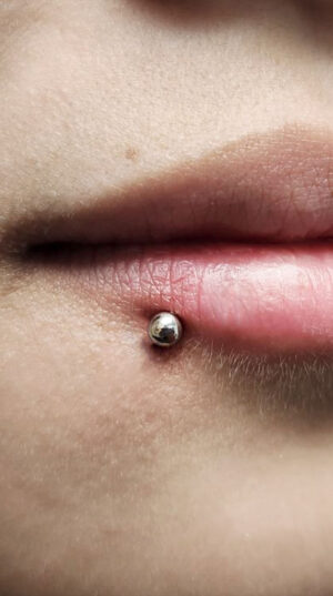 atticue tattoo, lip piercing