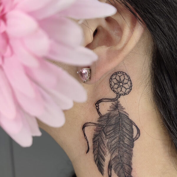 atticus tattoo, black and grey tattoo of a dreamcatcher with feathers
