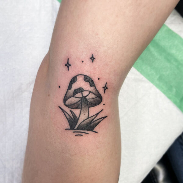 atticus tattoo, black and grey, American traditional tattoo of a mushroom with sparkles