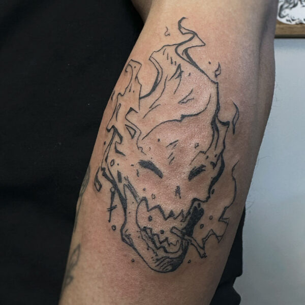 atticus tattoo, black and grey tattoo of a flaming skull