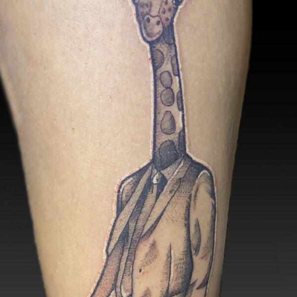 atticus tattoo, sticker tattoo of a giraffe wearing a hat and suit with tie