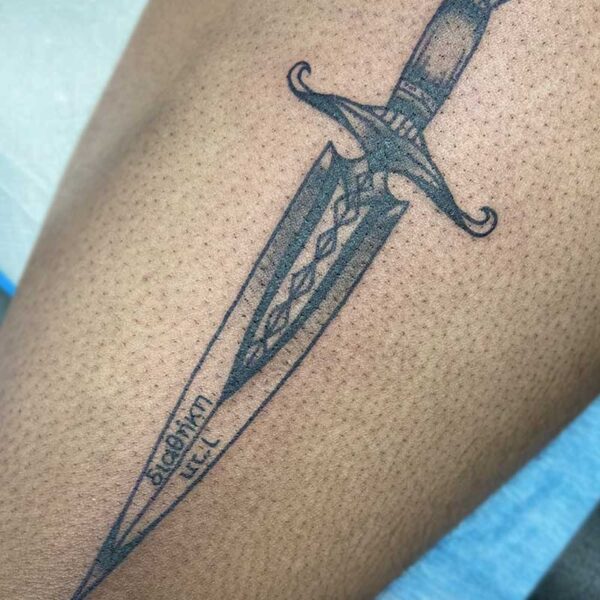 atticus tattoo, black and grey tattoo of a decorated dagger