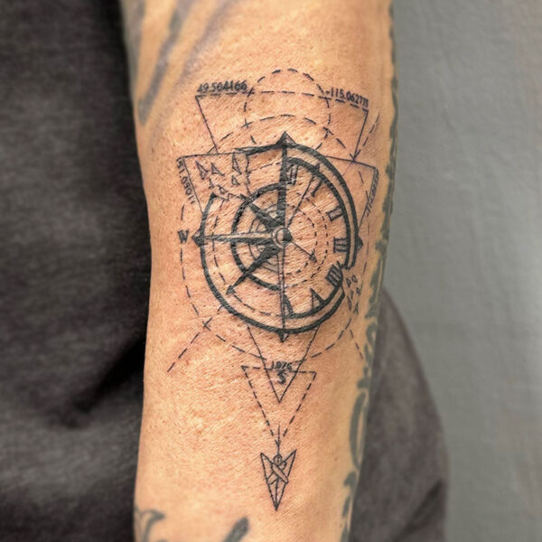 atticus tattoo, fine line tattoo of a compass with triangles