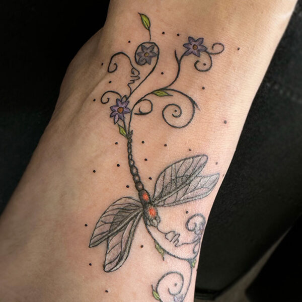 atticus tattoo, tattoo of a orange dragonfly with swirls and purple flowers