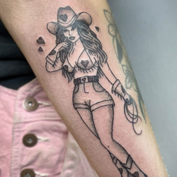 atticus tattoo, American Traditional tattoo of a Cowgirl with hearts