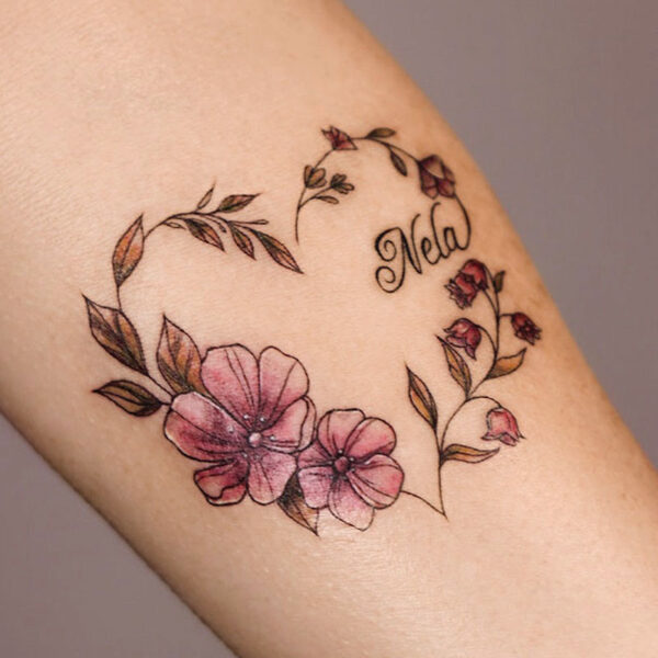 atticus tattoo, fine line, coloured tattoo of flowers in the shape of a heart