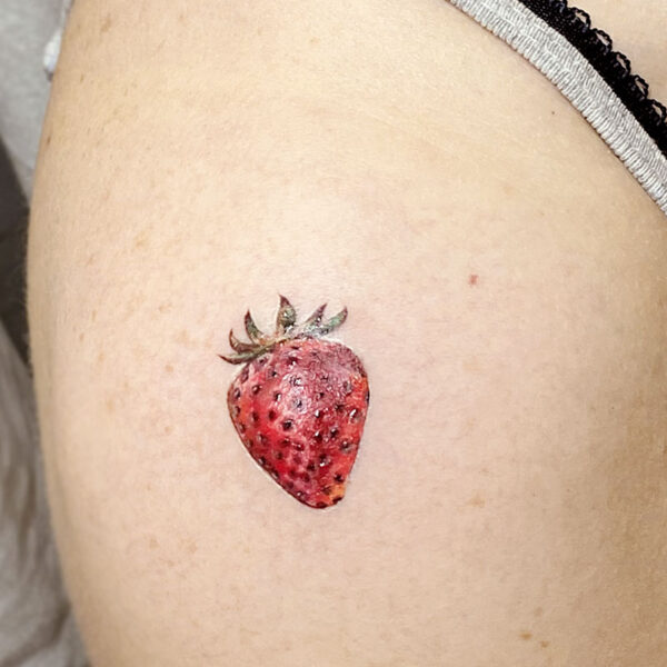 atticus tattoo, realism tattoo of a strawberry
