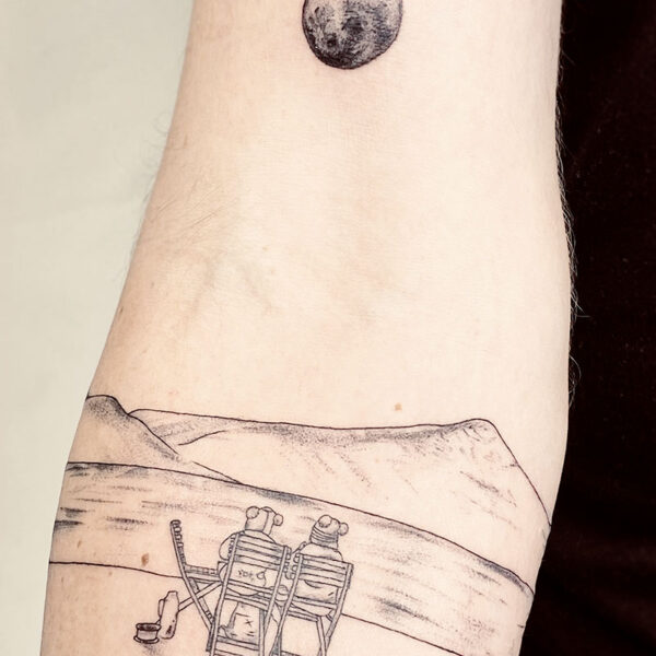 atticus tattoo, black and grey tattoo of two people sitting in chairs looking at mountains and the moon