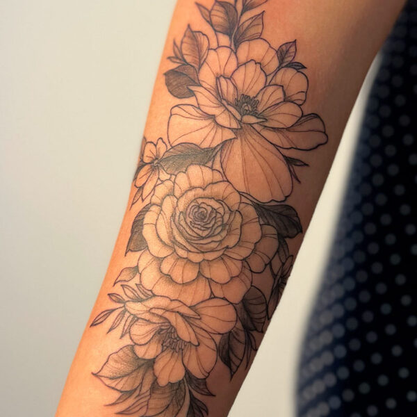 Fine line tattoo of peonies and roses