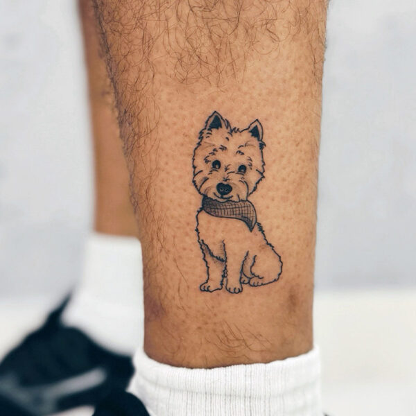 Black and grey tattoo of a white terrier dog wearing a bandana