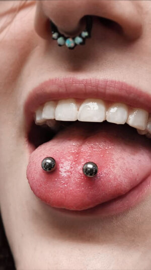 woman_septum_tongue_piercing