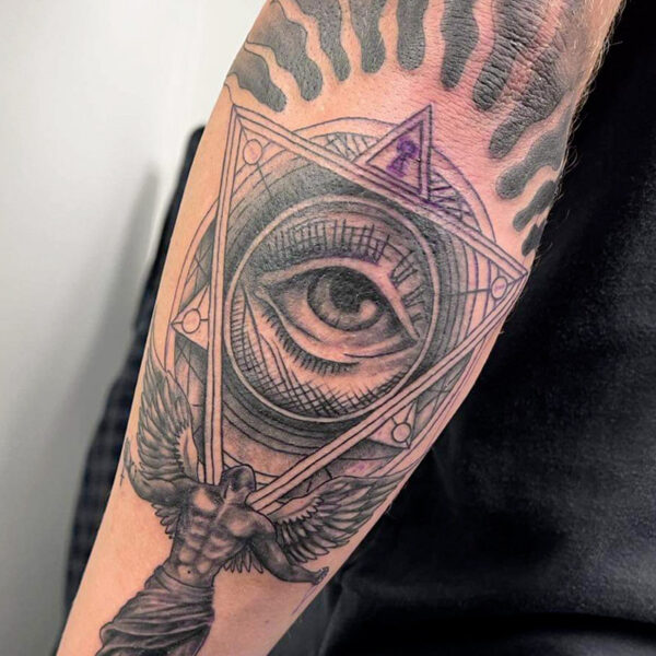 Atticus Tattoo| Abstract tattoo of geometric shapes with an eye in the centre and an angel below them