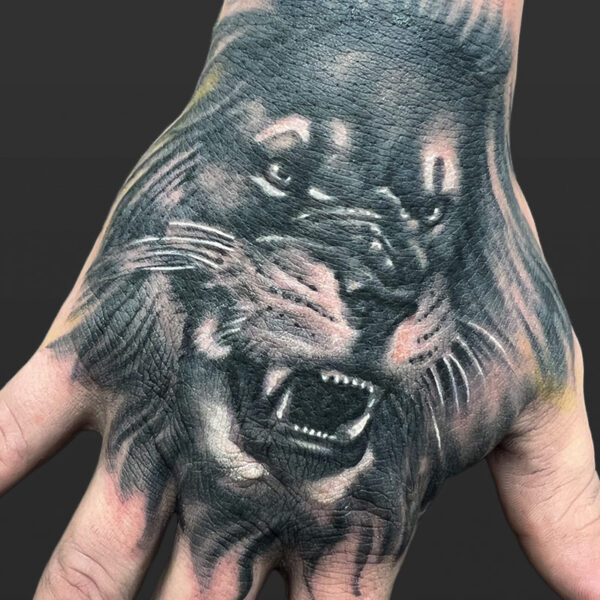 Atticus Tattoo| Black and grey, realism tattoo of of a lion