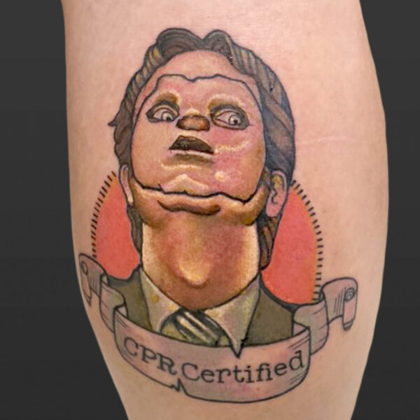 Atticus tattoo| Coloured tattoo of Dwight from the office, wearing a fake, human skin mask