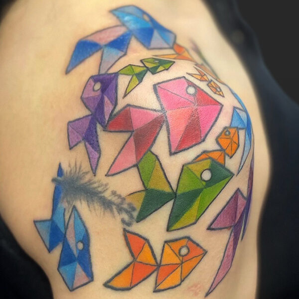 Atticus Tattoo| Coloured tattoo of several geometric fish