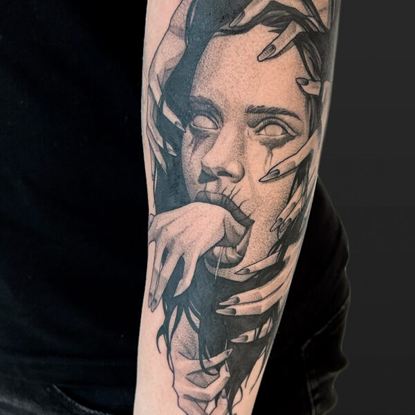 Atticus Tattoo| Black and grey tattoo of a woman with several hands grabbing her face and a hand coming out of her mouth