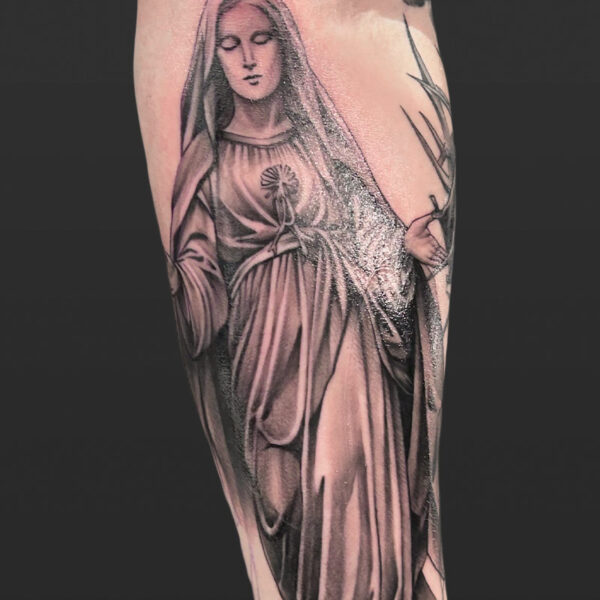 Atticus Tattoo| Black and grey, realism tattoo of the statue of Mary
