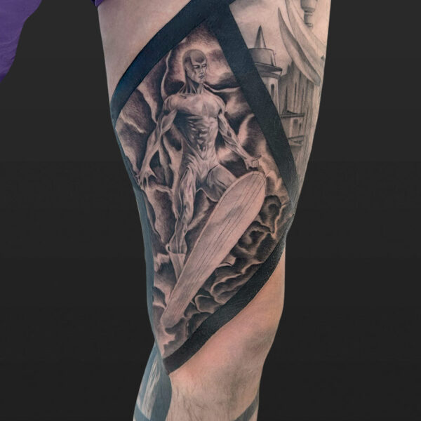 Atticus Tattoo| Black and grey tattoo of Silver Surfer from Marvel, with scenes of other Marvel characters