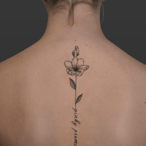 Atticus Tattoo| Fine line, spine tattoo of a flower with the words "pinky promise" in the stem