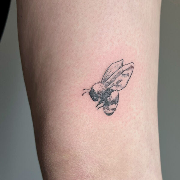 Atticus Tattoo| Fine line tattoo of a bumblebee