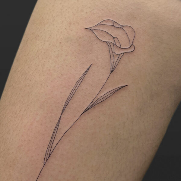Atticus Tattoo| Fine line tattoo of a Calla Lily