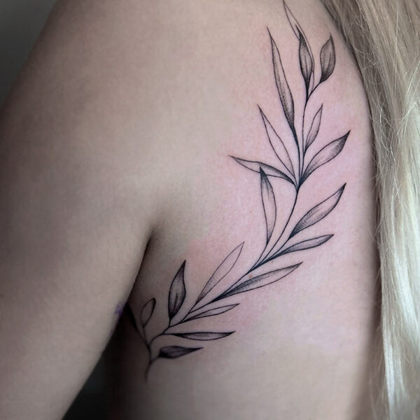 Atticus Tattoo| Fine line tattoo of a stem of leaves