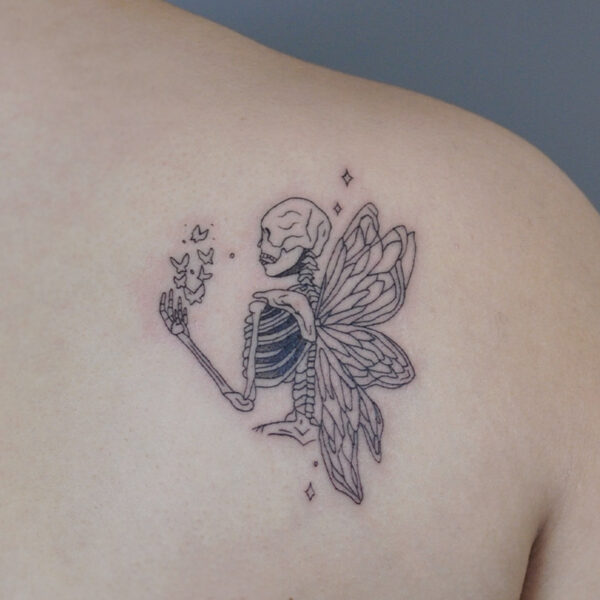 Atticus Tattoo| Fine line tattoo of a skeleton with fairy wings and holding butterflies