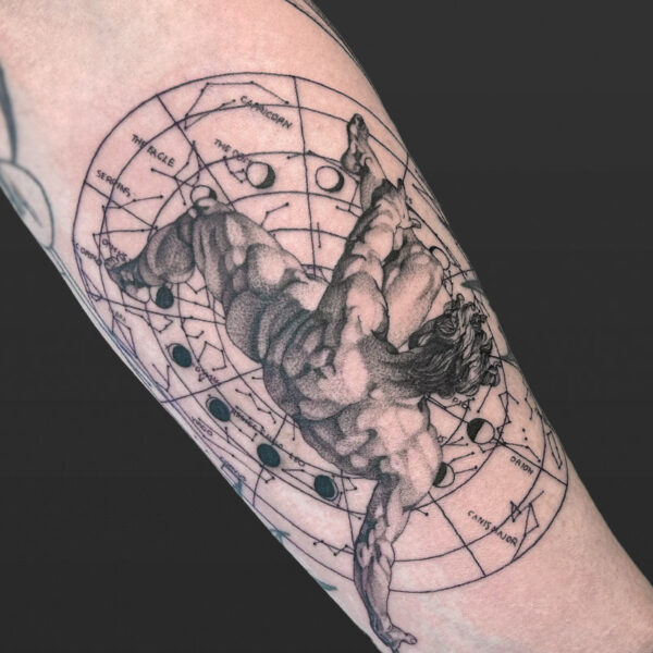 Atticus Tattoo| Black and grey, realism tattoo of Icarus falling and a fine line, zodiac map behind him