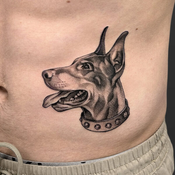 Atticus Tattoo| Black and grey, realism tattoo of a doberman