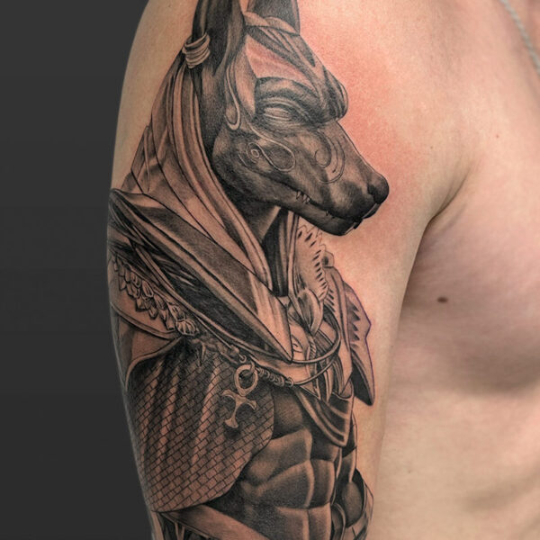 Atticus Tattoo| Black and grey, realism tattoo of Anubis