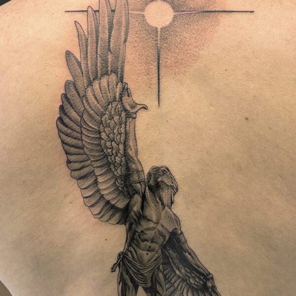Atticus Tattoo| Black and grey, realism tattoo of Icarus reaching towards the sun