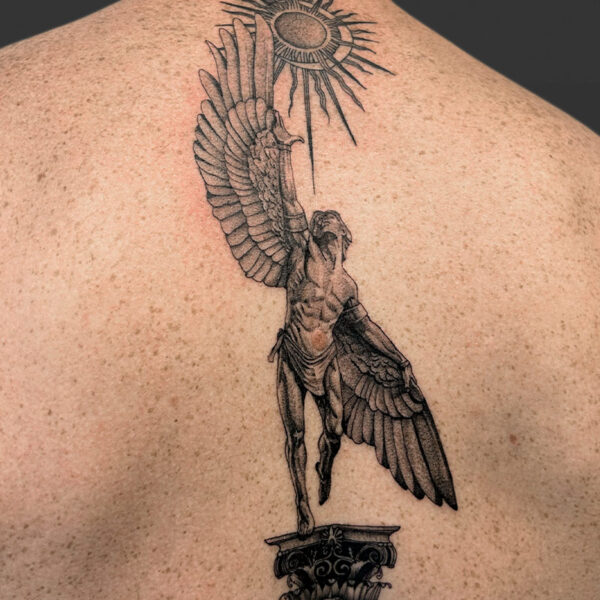 Atticus Tattoo| Black and grey, realism tattoo of Icarus reaching towards the sun and standing on a pillar