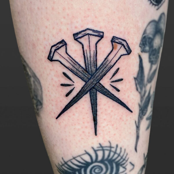 Atticus Tattoo| American traditional tattoo of three railway nails
