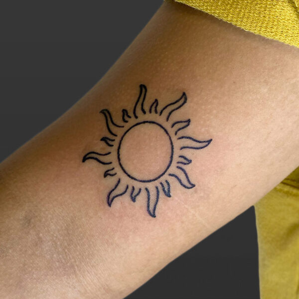 Atticus Tattoo| Line tattoo of the sun
