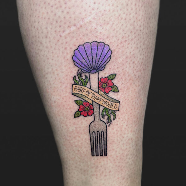 Atticus Tattoo| American traditional tattoo of a fork with a purple clam shell, red flowers, seaweed and a ribbon with the words "Part of that world", from "The Little Mermaid"