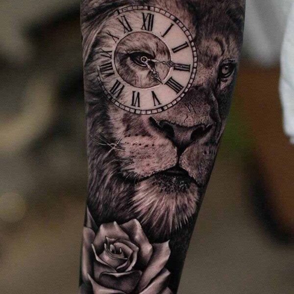 Atticus Tattoo| Black and grey realism tattoo of a lion with a clock and rose